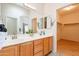 Bathroom features double sinks, a large mirror, and a walk-in closet at 3252 E Maldonado Dr, Phoenix, AZ 85042