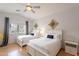 Bedroom with vaulted ceiling features two beds and wood floors at 3252 E Maldonado Dr, Phoenix, AZ 85042
