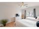 Bedroom featuring two beds, wood floors and a ceiling fan at 3252 E Maldonado Dr, Phoenix, AZ 85042
