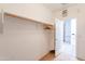 Open walk-in closet featuring wood floors and a hanging rack at 3252 E Maldonado Dr, Phoenix, AZ 85042