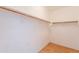 Walk-in closet featuring wood floors and clothes racks at 3252 E Maldonado Dr, Phoenix, AZ 85042