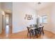 Dining room with modern light fixture, and an adjacent doorway and window at 3252 E Maldonado Dr, Phoenix, AZ 85042