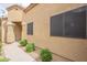 A cozy home featuring a decorative entrance, landscaped yard, and a classic tile roof at 3252 E Maldonado Dr, Phoenix, AZ 85042