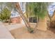 Charming home exterior with lush trees, desert landscaping, and a well-maintained lawn at 3252 E Maldonado Dr, Phoenix, AZ 85042