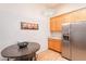 This kitchen features a stainless steel refrigerator and stylish light fixture at 3252 E Maldonado Dr, Phoenix, AZ 85042
