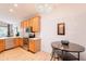 Bright kitchen with wood floors, stainless steel appliances, and a modern light fixture at 3252 E Maldonado Dr, Phoenix, AZ 85042
