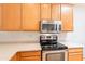This kitchen features stainless steel appliances and bright white countertops at 3252 E Maldonado Dr, Phoenix, AZ 85042