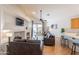 A bright living area with hardwood floors, a fireplace, and a large sliding glass door at 3252 E Maldonado Dr, Phoenix, AZ 85042