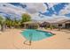 Resort-style pool with shaded seating, grilling area, and lush desert landscaping for community enjoyment at 3252 E Maldonado Dr, Phoenix, AZ 85042