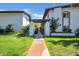 Inviting townhome exterior with well-maintained landscaping and walkway to the gated front courtyard at 3637 E Monterosa St # 3, Phoenix, AZ 85018