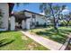 Charming exterior view of home with lush landscaping, walkway, and arbor at 3637 E Monterosa St # 3, Phoenix, AZ 85018