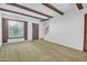 Bright living room features exposed ceiling beams, neutral walls, and a staircase to the second floor at 3637 E Monterosa St # 3, Phoenix, AZ 85018