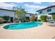 Inviting community pool surrounded by lounge chairs and well-maintained landscaping at 3637 E Monterosa St # 3, Phoenix, AZ 85018