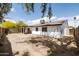 The home features a large, sunny backyard with ample space and tree shade at 4133 E Pleasant Ln, Phoenix, AZ 85042