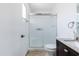 The bathroom features a modern vanity, toilet, and shower with glass doors, with elegant fixtures and finishes at 4133 E Pleasant Ln, Phoenix, AZ 85042