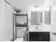 A well-lit bathroom featuring modern fixtures, a sleek vanity, and a toilet is designed for both style and comfort at 4133 E Pleasant Ln, Phoenix, AZ 85042