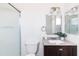 The bathroom features a modern vanity, toilet, and shower with glass doors, with elegant fixtures and finishes at 4133 E Pleasant Ln, Phoenix, AZ 85042