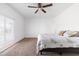 A sunlit bedroom offers a calm space, highlighted by a ceiling fan and a window that provides plenty of natural light at 4133 E Pleasant Ln, Phoenix, AZ 85042