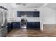 A modern kitchen boasts stainless steel appliances and plenty of cabinet space, perfect for cooking and entertaining at 4133 E Pleasant Ln, Phoenix, AZ 85042