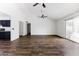 Spacious living room features modern ceiling fans and glass sliding doors, showcasing an open layout at 4133 E Pleasant Ln, Phoenix, AZ 85042