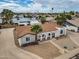 Aerial view of a house with a palm tree in the front yard in a well established neighborhood at 5127 W Willow Ave, Glendale, AZ 85304