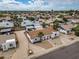 Aerial view of home with arched patio and palm trees in established neighborhood at 5127 W Willow Ave, Glendale, AZ 85304