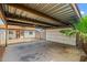 Large open carport offers ample parking, features a storage shed, and leads to back door at 5127 W Willow Ave, Glendale, AZ 85304