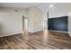 Spacious open-concept living room with wood-look floors and modern paint scheme at 5127 W Willow Ave, Glendale, AZ 85304