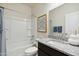 Bright bathroom with granite vanity, modern fixtures, and a shower-tub combination at 5751 E Axle Ln, San Tan Valley, AZ 85140