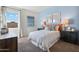 Cozy bedroom with soft lighting, stylish decor, and a comfortable bed is perfect for relaxation and rest at 5751 E Axle Ln, San Tan Valley, AZ 85140