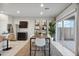 Modern dining area with sleek table and chairs, next to the kitchen, provides a cozy and inviting place for meals at 5751 E Axle Ln, San Tan Valley, AZ 85140