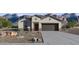 Charming single-story home featuring desert landscaping and a two-car garage with mountain views at 5751 E Axle Ln, San Tan Valley, AZ 85140