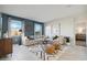 Spacious living room is filled with natural light, stylish decor, and comfortable seating, creating an inviting atmosphere at 5751 E Axle Ln, San Tan Valley, AZ 85140