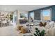 Bright and airy living room features stylish decor, comfortable seating, and plenty of natural light at 5751 E Axle Ln, San Tan Valley, AZ 85140