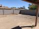 A spacious backyard featuring a block wall and plenty of room to create your own outdoor space at 6226 W Coronado Rd, Phoenix, AZ 85035
