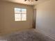 A bedroom featuring a window and natural lighting at 6226 W Coronado Rd, Phoenix, AZ 85035