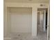 Bedroom view showing a closet with ample space and open doorway leading to a hallway at 6226 W Coronado Rd, Phoenix, AZ 85035