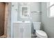 Bathroom showcasing sleek vanity, illuminated mirror, and tiled shower at 6316 N 23Rd Ave, Phoenix, AZ 85015
