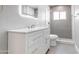 Modern bathroom featuring a stylish vanity, a tiled shower, and a large, illuminated mirror at 6316 N 23Rd Ave, Phoenix, AZ 85015