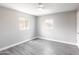 Bedroom with modern ceiling fan, wood-look flooring, and bright natural light at 6316 N 23Rd Ave, Phoenix, AZ 85015