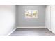 Bright bedroom with wood-look floors, closet, and window for natural light at 6316 N 23Rd Ave, Phoenix, AZ 85015