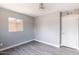 Inviting bedroom with a bright window, grey walls, and light wood flooring at 6316 N 23Rd Ave, Phoenix, AZ 85015