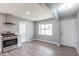 Spacious kitchen featuring stainless steel appliances, white cabinets, and a bright window at 6316 N 23Rd Ave, Phoenix, AZ 85015
