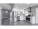 Stylish kitchen featuring stainless steel appliances, white cabinets, and grey walls for a modern look at 6316 N 23Rd Ave, Phoenix, AZ 85015