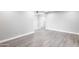 Bright living room with grey walls and light wood flooring, seamlessly connecting to adjacent spaces at 6316 N 23Rd Ave, Phoenix, AZ 85015