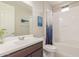 Bathroom featuring tub with shower, toilet and large single sink vanity with modern fixtures at 686 N 152Nd Dr, Goodyear, AZ 85338