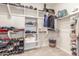 Spacious walk-in closet with organized shelving and storage for clothing, shoes, and accessories at 686 N 152Nd Dr, Goodyear, AZ 85338