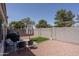 Cozy backyard featuring artificial turf, seating area, and grill, perfect for outdoor entertaining at 7028 W Lincoln St, Peoria, AZ 85345