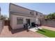 Backyard featuring artificial turf, seating area, and grill, perfect for outdoor entertaining at 7028 W Lincoln St, Peoria, AZ 85345