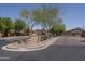 Townsend Square community entrance featuring lush landscaping and well-maintained grounds at 7028 W Lincoln St, Peoria, AZ 85345